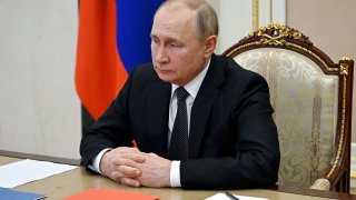 Russian President Vladimir Putin chairs a meeting with members of the Security Council via a video link at the Novo-Ogaryovo state residence outside Moscow, Russia February 18, 2022.