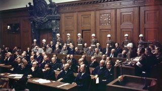 FILE – Defendants listen to part of the verdict in the Palace of Justice during the Nuremberg War Crimes Trial in Nuremberg, Germany on Sept. 30, 1946.