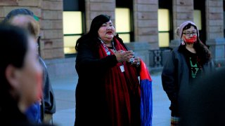 Candi Brings Plenty, the indigenous justice organizer for the ACLU of South Dakota, prays during a demonstration outside of the Capitol in Pierre, S.D.