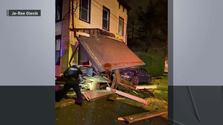 Photo shared by family shows car crashed into the front porch of a residential building.