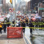 Police and first responders gather at the entrance of the 36th Street subway station in the Brooklyn neighborhood of Sunset Park, April 12, 2022, in New York.