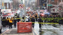 Police and first responders gather at the entrance of the 36th Street subway station in the Brooklyn neighborhood of Sunset Park, April 12, 2022, in New York.