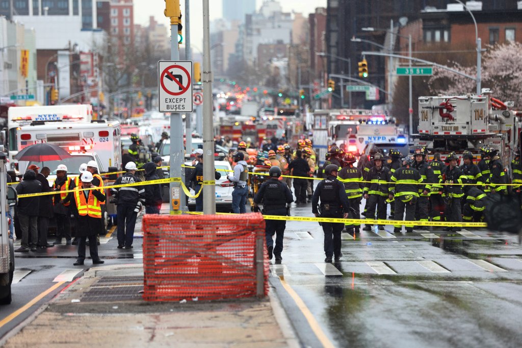 Police and first responders gather at the entrance of the 36th Street subway station in the Brooklyn neighborhood of Sunset Park, April 12, 2022, in New York.
