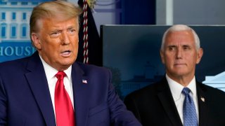 FILE - In this Nov. 24, 2020, file photo President Donald Trump speaks in the press briefing room as Vice President Mike Pence listens in Washington.