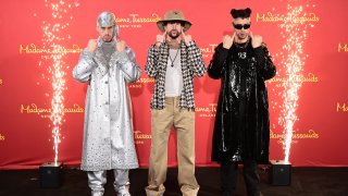 Bad Bunny (C) reveals wax figures for Madame Tussauds New York and Madame Tussauds Orlando at Madame Tussauds on April 19, 2022 in New York City.