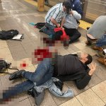 Injured subway riders seen on the platform of the 36th Street station in Brooklyn's Sunset Park neighborhood in New York, April 12, 2022. At least five people have been shot by a man in a gas mask and orange construction vest, according to the NYPD.