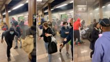 Riders run from a train car at the 36th Street subway station in Brooklyn's Sunset Park neighborhood in New York, April 12, 2022. A man had set off a smoke canister on a train car before shooting at fellow riders.