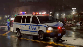 Marked police van with damaged hood in Brooklyn