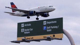 A Delta Airlines commercial aircraft approaches to land at John Wayne Airport in Santa Ana, California January 18, 2022.