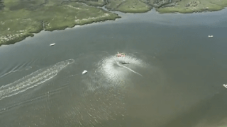 Aerial shot of helicopter searching for men in the water after their boats collided on the Wilmington river.
