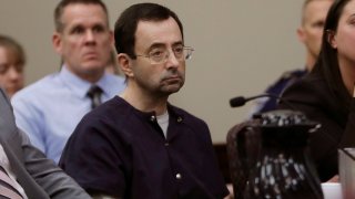 Larry Nassar sits during his sentencing hearing Wednesday, Jan. 24, 2018, in Lansing, Mich. The former sports doctor who admitted molesting some of the nation's top gymnasts for years was sentenced Wednesday to 40 to 175 years in prison as the judge declared: "I just signed your death warrant." The sentence capped a remarkable seven-day hearing in which scores of Nassar's victims were able to confront him face to face in the Michigan courtroom.