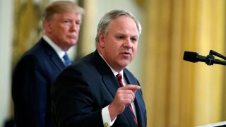 FILE - In this July 8, 2019 file photo President Donald Trump listens as Secretary of the Interior David Bernhardt speaks during an event on the environment in the East Room of the White House in Washington. Seventeen states sued the Trump administration Wednesday, Sept. 25, 2019, to block rules weakening the Endangered Species Act, saying the changes would make it tougher to protect wildlife even in the midst of a global extinction crisis.