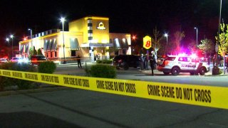 Buffalo Wild Wings parking lot closed for murder investigation.