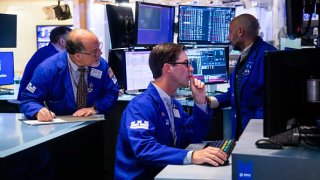 Traders work on the floor of the New York Stock Exchange (NYSE) in New York, US, on Tuesday, May 31, 2022.