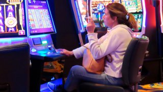 Woman smoking while gambling