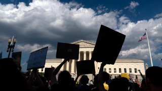 FILE – Abortion-rights activists protest outside the Supreme Court in Washington, Saturday, June 25, 2022. The Supreme Court’s ruling allowing states to regulate abortion has set off a mad travel scramble across the country to direct patients to states that still allow the procedure. (AP Photo/Jose Luis Magana, File)