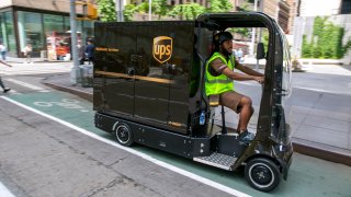 UPS worker peddles an eQuad electric bike