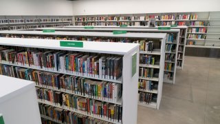 Various shelves of books within a library