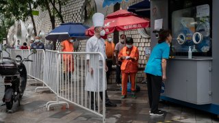 Chinese cities like Beijing, pictured here on July 6, 2022, require negative virus tests from within the last 72 hours in order to enter most public spaces.