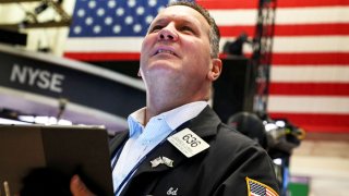 A trader works on the floor of the New York Stock Exchange (NYSE) in New York City, July 13, 2022.