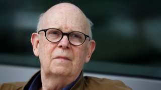FILE - Pop artist Claes Oldenburg watches as his sculpture "Paint Torch" is installed by the George Young Company at the Pennsylvania Academy of the Fine Arts in Philadelphia on Saturday, Aug. 20, 2011. Oldenburg died Monday, July 18, 2022, in Manhattan, according to his daughter, Maartje Oldenburg. He had been in poor health since falling and breaking his hip a month ago. He was 93.