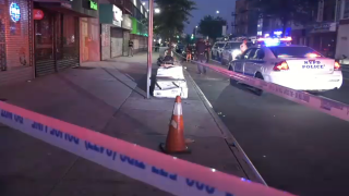 A crime scene in Queens where an off-duty correction officer was shot in the leg Saturday morning.