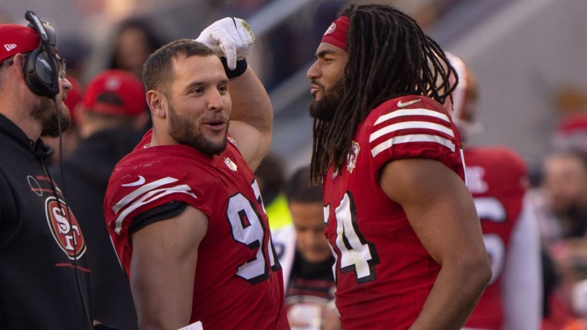 Dec 19, 2021; Santa Clara, California, USA; San Francisco 49ers defensive end Nick Bosa (97) talks with middle linebacker Fred Warner (54) on the sidelines during the third quarter against the Atlanta Falcons at Levi’s Stadium. Mandatory Credit: Stan Szeto-USA TODAY Sports