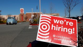 A hiring sign is posted in front of a Target store on February 05, 2021 in San Rafael, California.