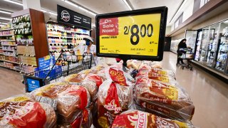 People shop at a supermarket in Montebello, California, on August 23, 2022.
