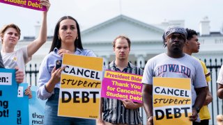 Activists gather to rally in support of cancelling student debt, in front of the White House in Washington, DC, on August 25, 2022.