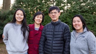 Xiaoxing Xi and his wife, Qi Li, with their daughters.