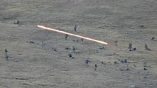 Azerbaijanian servicemen cross the Armenian-Azerbaijani border, approaching Armenian positions, Sept. 13, 2022. Armenia said 49 soldiers died from Tuesday's attack, while Azerbaijan said they lost 50 of their troops.