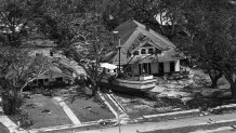 The shrimper "Wade Klein" is thrown against a house facing the beach in Biloxi, Mississippi, Aug. 18, 1969, shortly after Hurricane Camille tore through the Mississippi Gulf Coast.