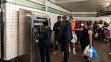People seen in line to buy MTA (Metropolitan Transit Authority) issued commemorative MetroCard to celebrate Notorious B.I.G.'s 50th Birthday distributed across 3 subway stations in Brooklyn and advertised it on posters.