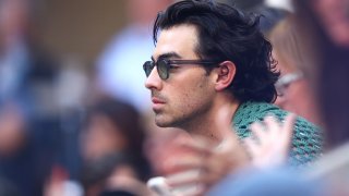NEW YORK, NEW YORK – SEPTEMBER 10: Joe Jonas looks on during the Women’s Singles Final match between Iga Swiatek of Poland and Ons Jabeur of Tunisia on Day Thirteen of the 2022 US Open at USTA Billie Jean King National Tennis Center on September 10, 2022 in the Flushing neighborhood of the Queens borough of New York City. (Photo by Elsa/Getty Images)