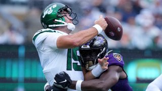 Outside Linebacker Justin Houston #50 of the Baltimore Ravens forces an incomplete pass on Quarterback Joe Flacco #19 of the New York Jets