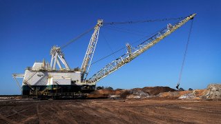 FILE - A Mosaic Co. dragline carves out a phosphate matrix in Tampa, Florida, Dec. 2, 2011.