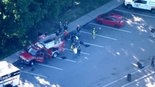 Emergency crews respond to a parking lot near the cliff where a Connecticut man fell 60 feet, police said.