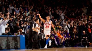 Jeremy Lin #17 of the New York Knicks reacts to the corwd after hitting a three point shot during the game against the Los Angeles Lakers on February 10, 2012 at Madison Square Garden in New York City.