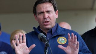 Florida Governor Ron DeSantis speaks during a press conference to update information about the on ongoing efforts to help people after hurricane Ian passed through the area on October 4, 2022 in Cape Coral, Florida.