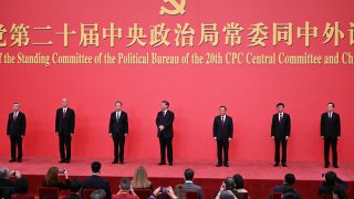 China’s President Xi Jinping (C) and other members of the Communist Party of China’s Politburo Standing Committee meet the media in the Great Hall of the People in Beijing on Oct. 23, 2022.