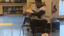 A photo of Camdan McWright reading to 4th Grade students at St. Genevieve Elementary School during the 2021-2022 school year. Photo Courtesy St. Genevieve Parish Schools.