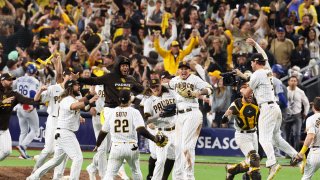 San Diego, CA, Saturday, October 15, 2022 – The San Diego Padres celebrate defeating the Los Angeles Dodgers 5-3 in game 4 of the League Division Series at Petco Park. (Robert Gauthier/Los Angeles Times via Getty Images)