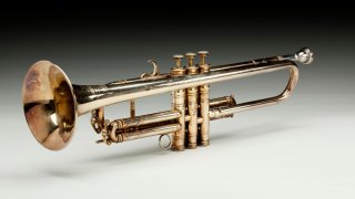 A photo of a trumpet owned by Louis Armstrong