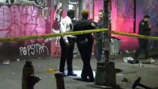 Cops outside a venue in Bushwick, Brooklyn, investigate a slashing that sent three men to the hospital.