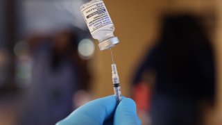 A pharmacist prepares to administer COVID-19 vaccine booster shots during an event hosted by the Chicago Department of Public Health at the Southwest Senior Center on September 09, 2022 in Chicago, Illinois. The recently authorized booster vaccine protects against the original SARS-CoV-2 virus and the more recent omicron variants, BA.4 and BA.5.