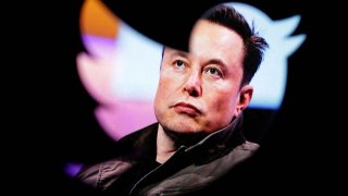 Elon Musk’s photo is seen through a Twitter logo in this illustration taken October 28, 2022.