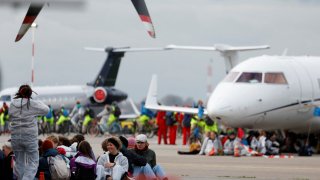 Climate activists protest against environmental pollution from aviation at Amsterdam’s Schiphol Airport, in Schiphol, Netherlands November 5, 2022.