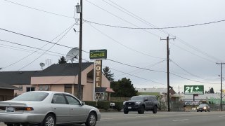 Cars drive by the Emerald Motel in North Seattle on Friday, Nov. 11, 2022.