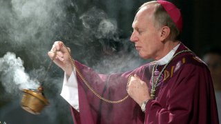 FILE – Bishop Howard Hubbard swings incense during an Ash Wednesday communion service at the Cathedral of the Immaculate Conception on Feb. 25, 2004, in Albany, N.Y. Hubbard, now retired and who has admitted to covering up for predator priests and has himself been accused of sexual abuse, has asked Pope Francis to laicize him, or remove him from the priesthood. Hubbard, 84, announced the decision in a statement Friday, Nov. 18, 2022, the day the United Nations has designated as the World Day for Previous of Child Sexual Abuse and Exploitation. (AP Photo/Jim McKnight, File)